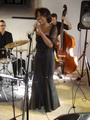 Stage scene during a jazz concert at the Neumarkt residence showing singer and vocal artist Willetta Carson and musicians. 