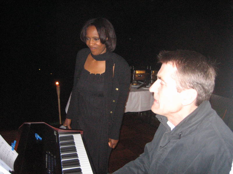 Willetta Carson in duo jazz ensemble at a private party in Heidelberg, Germany. Picture shows Willetta next to the piano player performing at the piano.